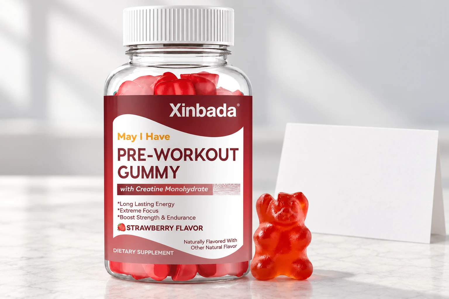 Xinbada gummy bottle and one red bear-shaped gummy on an illustrative sample review bench